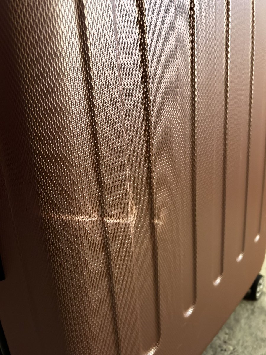 writermichaela's tweet photo. hey @SouthwestAir if you consider several major dents on brand new, never used before, luggage that had a protective cover on it “normal wear and tear,” I’d hate to see what you think real damage is. This is why we’re flying @Delta from now on. https://t.co/vcSCO43DY4