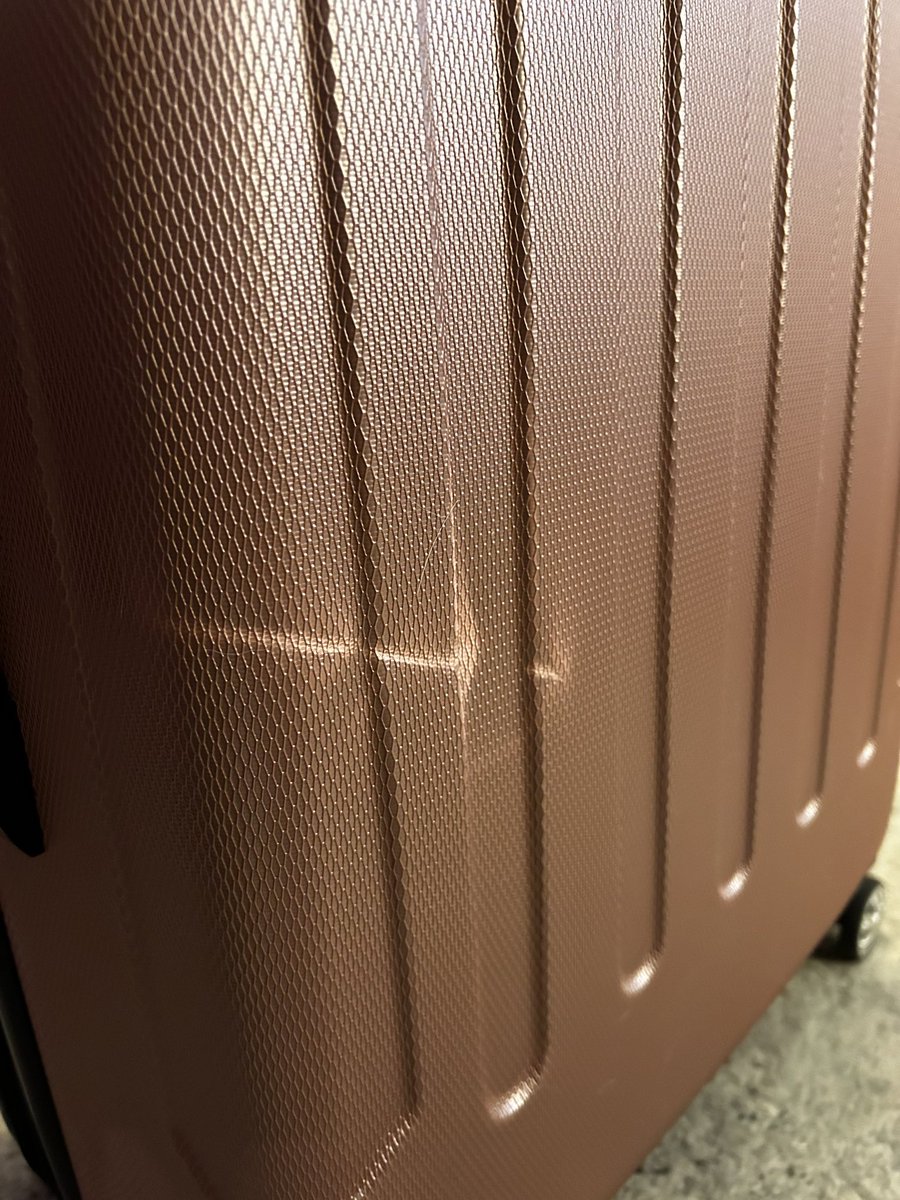 writermichaela's tweet photo. hey @SouthwestAir if you consider several major dents on brand new, never used before, luggage that had a protective cover on it “normal wear and tear,” I’d hate to see what you think real damage is. This is why we’re flying @Delta from now on. https://t.co/vcSCO43DY4