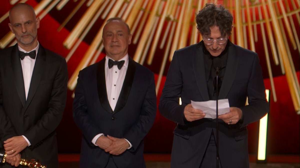 Jonathan Glazer accepts the Best International Feature Oscar for The Zone Of Interest: “All our choices were made to reflect and confront us in the present. Our film shows where dehumanisation leads at its worst.” He goes on to relate that to the dehumanisation happening in the