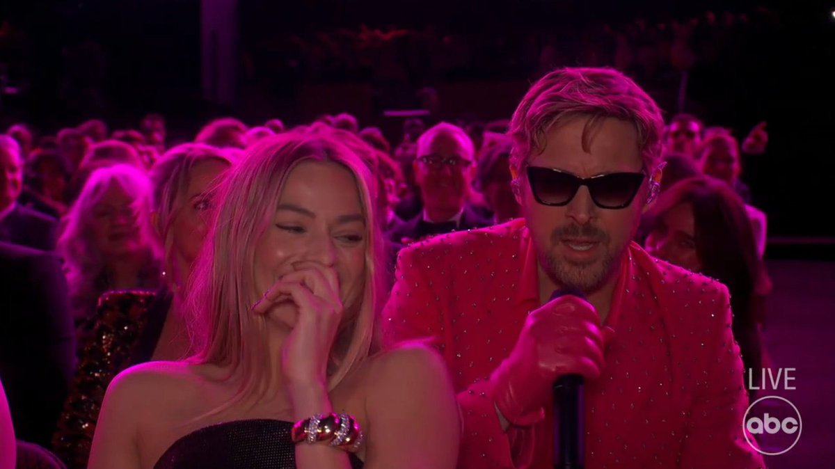 PopBase's tweet image. Margot Robbie during Ryan Gosling’s performance of ‘I’m Just Ken’ at the #Oscars.
