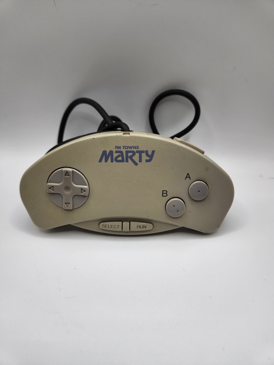 Posting one controller from my collection everyday until I run out, posted in no particular order.  Here we have controller #13, an FM Towns Marty controller.  The Marty was a consolized version of the Japanese-only FM Towns computer.