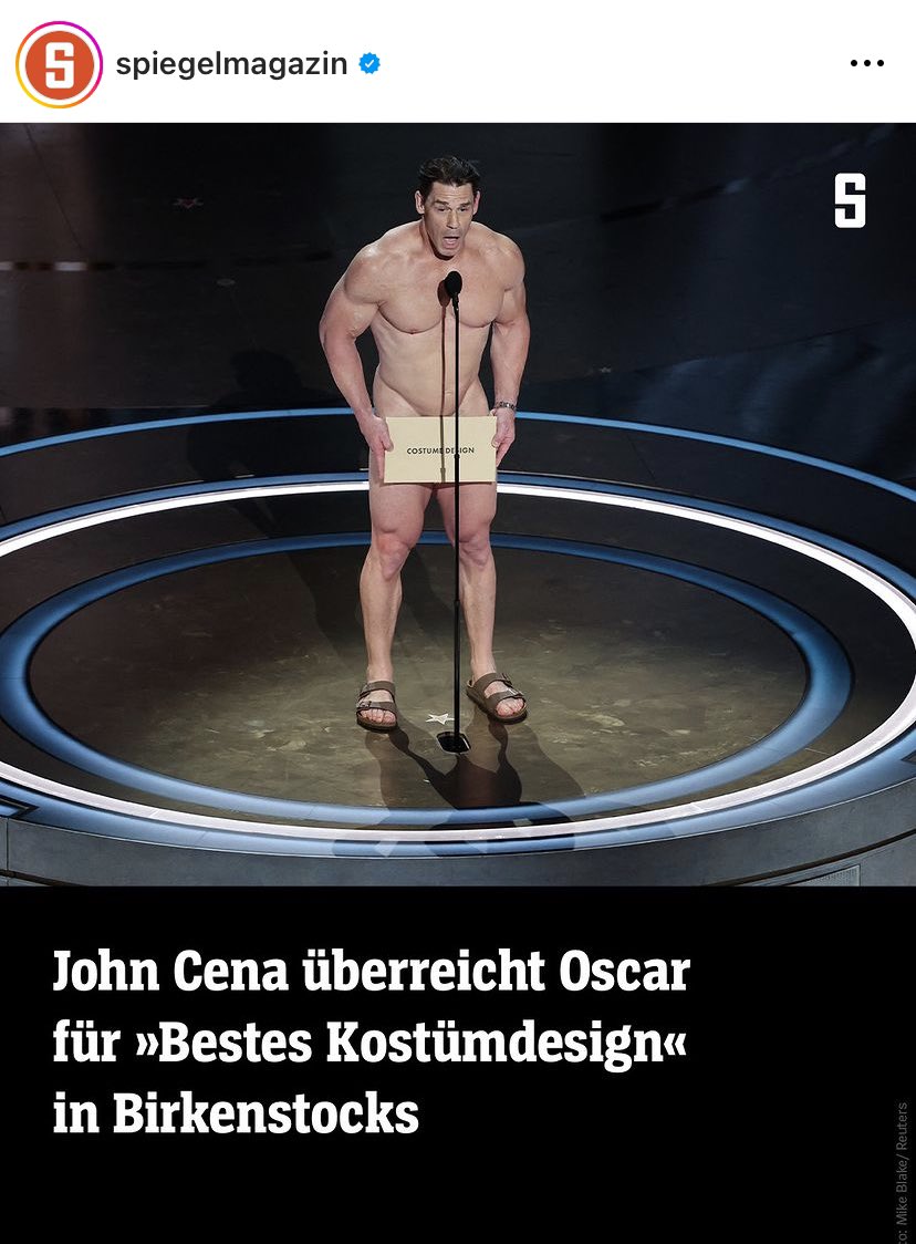 derJamesJackson's tweet photo. While everyone reports that John Cents gave the award naked, Der Spiegel describes him as wearing Birkenstocks. There’s always a local angle ! https://t.co/mqFCpHpZ0g