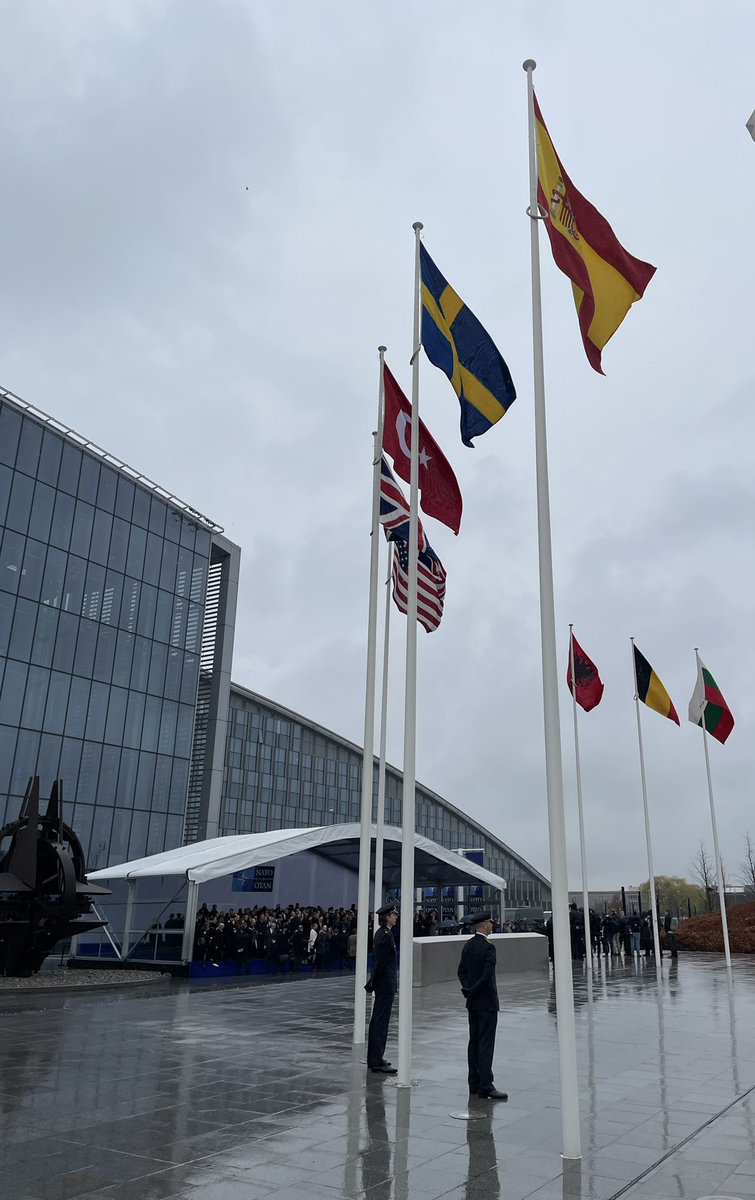 On a rainy Brussels day, Sweden under NATO's umbrella.