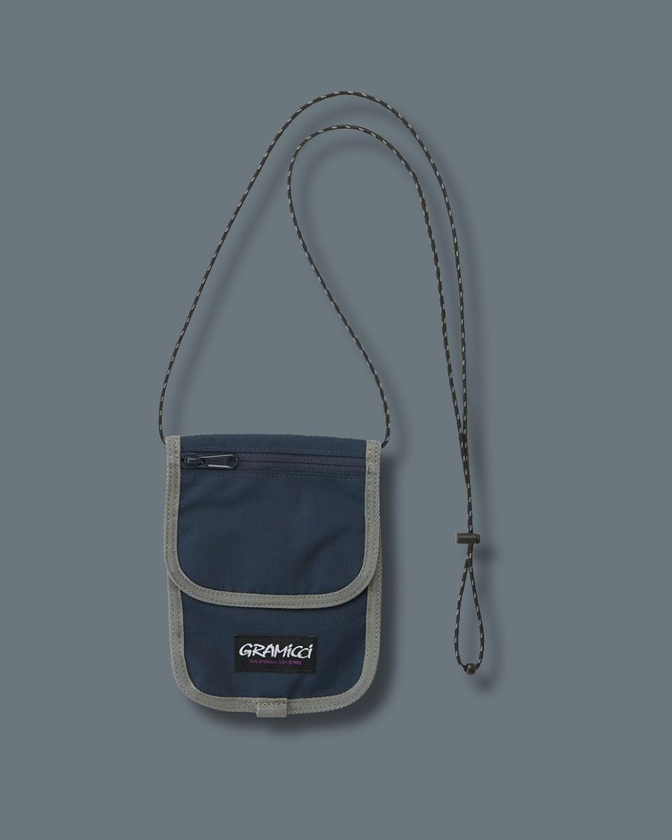 Gramicci Cordura Neck Pouch in Navy is a versatile and practical accessory that offers convenient storage for your essentials. The durable Cordura fabric ensures long-lasting durability, while the navy color adds a touch of style to your outfit. . #gramicci #travelaccessories