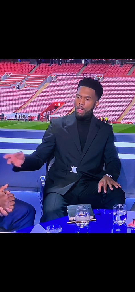 DanielSturridge's tweet photo. Me: I’m just gonna wear this black turtleneck with this simple black blazer. Then ppl can focus on what I have to say and wont have anything to say about my outfit. 

Internet: why does Sturridge have a seatbelt on!? 🤷🏾‍♂️😂😂 https://t.co/G5kFJRaz5z