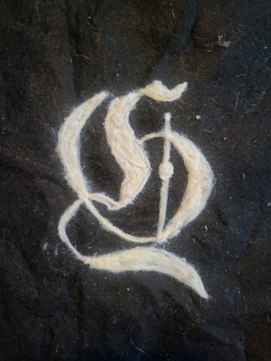 #Felting and #embroidery are ancient arts and were often used to place ornate calligraphy onto cloth. As an experiment, I felted the Gamelogica (an awesome #YouTube channel you should check out) logo on a thin piece of fabric.