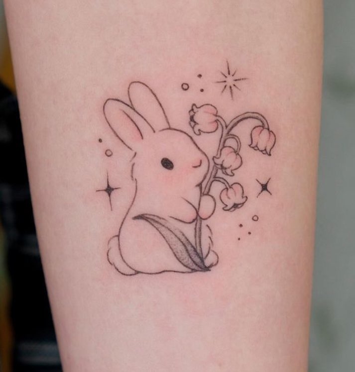 Esther Bunny tattoo done on the thigh, cartoon style.