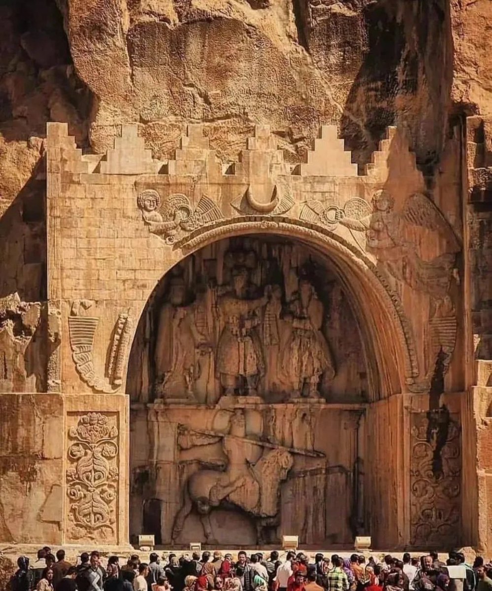 archeohistories's tweet photo. Taq-e Bostan (‘Arch of the garden’) is the name of one of those enchanting places so loved by the Persians in which nature and Man worked together to create a ‘Paradise’. Laid out around a pool surrounded by large trees that provide refreshing shade, this site a few miles from Kermanshah, Iran; is dominated by precipitous rock faces, at the base of which ancient sculptors expressed their artistry. Taq-e Bostan is the place where the sovereigns of Sasanian Empire  (224-651 AD), in obedience to an ancient water cult dedicated to the goddess Anahita, built a series of extremely interesting rock-cut monuments.

Taq-e Bostan is a part of Biston mountain in the middle of Zagros mountains. It was built in 3rd Century AD. At that time, Sassanid kings were more inclined to build their inscriptions, memorials and bas-reliefs in Fars  land, especially around  Persepolis. But during the time of Ardeshir II, Taq-e Bostan was chosen for this construction of carvings, bas-reliefs and figures effigies.

The fame of Taq-e Bostan is due to the bas-reliefs made in the heart of the mountain. Since Taq-e Bostan is located in a fertile area with springs and green plains, it was mostly noticed by Sassanid kings. Taq Bostan was also located on the Silk Road, and this was another reason why the Sassanid kings were interested in this area.

However, instead of investiture or triumphal scenes carved on the rock, there are artificial grottoes entirely hewn out of the rock.

• The large arch of the complex, which is also known as the large porch. It is related to the reign of Khosrow II also called Khosrow Parviz and in the years 590-628 AD.

• The small grotto of Taq-e Bostan, which is also known as the small porch, is the prominent image of Shapur III in 383-388 AD.

• The relief or inscription of the coronation of Ardeshir II from the years 379-383 AD.

All the characters carved on the inscriptions of Taq Bostan collection are formed with such elegance and masterful precision that you can see all the details in them.

📷© Persian Museum

#archaeohistories