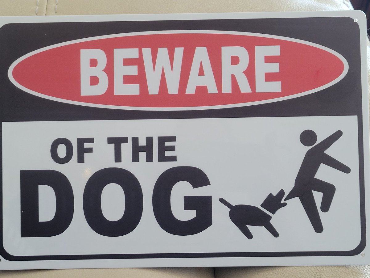 MimiProbably's tweet photo. A few days after I adopted Boss, #SpousalUnit thought it would be funny to pretend to kick me in the ass as I walked away from him. Neither Boss nor I thought this funny, but only one of us bit Pat in the ass. Found this sign today, and it's a rather uncanny re-enactment. https://t.co/nJ66uU0zyA