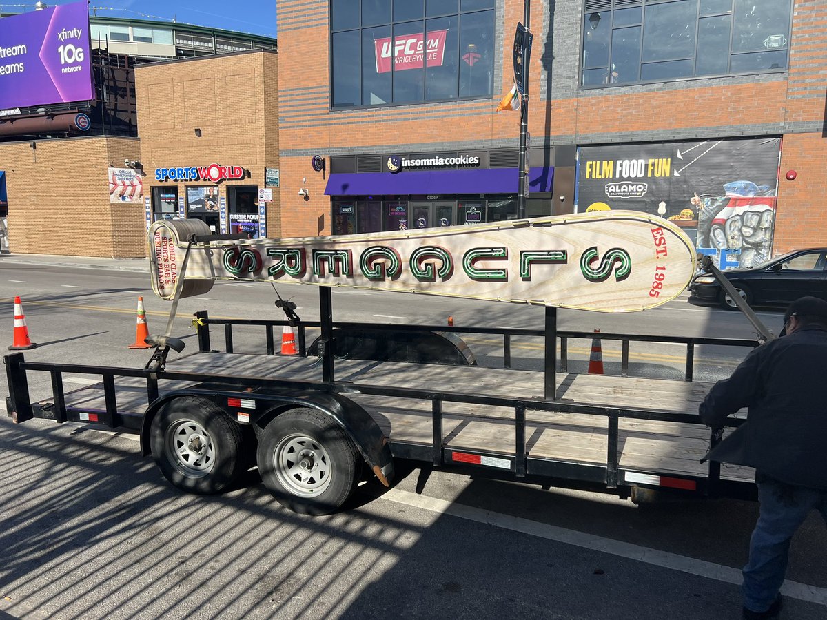 wischlist's tweet photo. The iconic sign at Sluggers on Clark Street in Wrigleyville is coming down and being replaced by a new one. 

I asked a worker where the old one is going. He didn’t know. I said the Chicago History Museum would be a cool destination. He agreed. ⚾️ 🍻 https://t.co/ZdCuVuwyuT