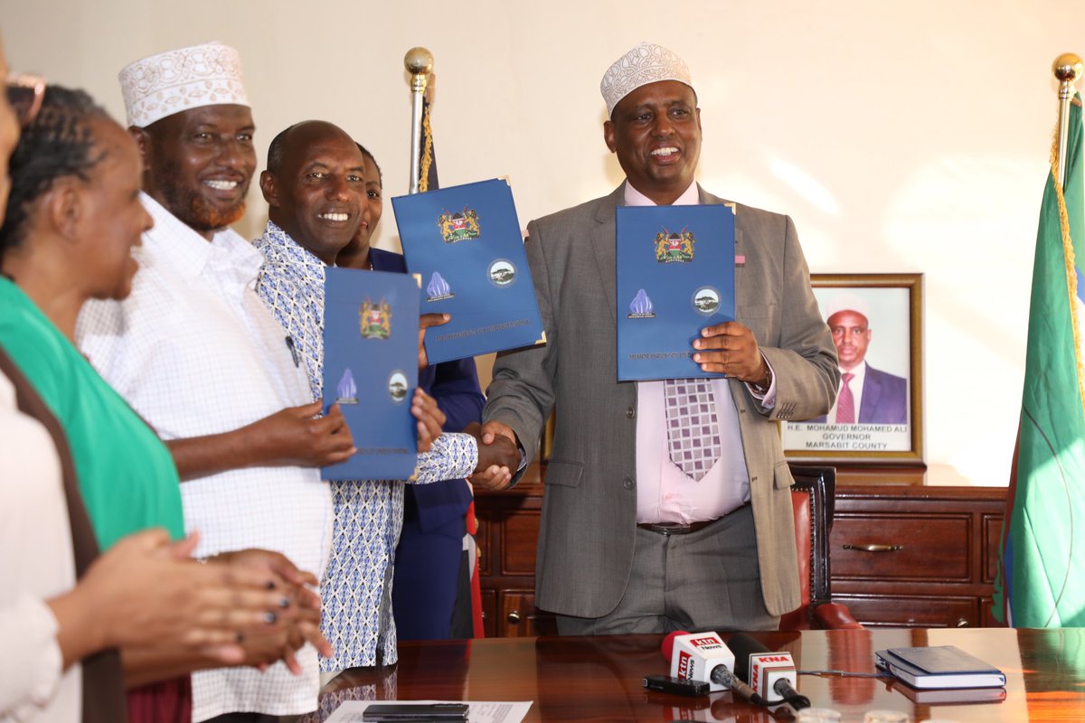 GovMohamudAli's tweet photo. Marsabit County is on the brink of a transformative era as the Principal Secretary for the Arid and Semi-Arid Lands (ASAL) and Regional Development, Hon. @harsama_kello and I announced the inception of the Wolda Integrated Agro-pastoralism Development Project, a collaborative effort between the County Government of Marsabit and the National Government. This groundbreaking initiative aims to provide a sustainable solution to the perennial drought challenges that have plagued the region.

We met to deliberate on the project's implementation, a meeting that marked a significant step forward in the journey towards resilience and prosperity for the pastoral communities.

The Walda Project is set to revolutionize the traditional pastoral practices by establishing feedlots as a reliable food source for livestock during drought periods. Spread over a minimum of 5,000 hectares, the project will also see the construction of five mega dams with the capacity to hold 2 million cubic meters of water, ensuring a year-round water supply. Additionally, the project plans to sink five boreholes to serve as an alternative water source should the dams and water pans run dry.

Following water security, the project's next phase will focus on fodder development and the introduction of special livestock breeding programs aimed at enhancing the quality of the local livestock breeds. Agricultural development is also on the agenda, with plans to cultivate food crops such as cereals and vegetables. Environmental conservation is another critical component, with a variety of trees set to be planted to maintain ecological balance.

The establishment of a research center is another cornerstone of the Walda Project. Here, specialists will conduct in-depth research on livestock breeds and crops, ensuring the adoption of best practices and the latest innovations in pastoral farming. Monitoring and evaluation mechanisms will be integrated to track the project's progress and impact.

I express my gratitude to President @WilliamsRuto for initiating such a transformative project in Marsabit County. I attribute the selection of Walda as the project site to the area's access to streams flowing from the Ethiopian highlands, fertile soil, and expansive land. The project's multifaceted approach is good, particularly the improvement of livestock breeds through the proposed research center and the training of local farmers. Recalling the severe impact of drought, where up to 80% of pastoral livelihoods were lost, I hail the Walda Project as a crucial lifeline for the community.

The Wolda Project ushers in a new chapter of hope for Marsabit. As we face the adversities brought on by climate change, it's time to adapt and build a future where our people are not only surviving but thriving.

PS Harsama echoed my sentiments, highlighting President Ruto's commitment to empowering pastoralists and mitigating the effects of climate change. He emphasized that ASAL counties have borne the brunt of climate-induced losses and that the president's vision for the feedlot program, which will extend to 31 ASAL counties, is a testament to the government's resolve to change the narrative around droughts and livestock loss. Marsabit, he noted, was chosen to spearhead the project due to its readiness to implement the necessary changes.

"We are here to chart a path of resilience and prosperity. This project is a beacon of innovation that will not only combat the cycle of drought but also empower our communities through sustainable development," the PS remarked.

The ambitious project, which is set to stock over 10,000 heads of cattle, comes with a substantial price tag of Ksh. 2.75 billion. The implementation of the project will be overseen by the Ewaso Ngiro North River Basin Development Authority in collaboration with county Government of Marsabit, bringing together expertise and resources to ensure its success.