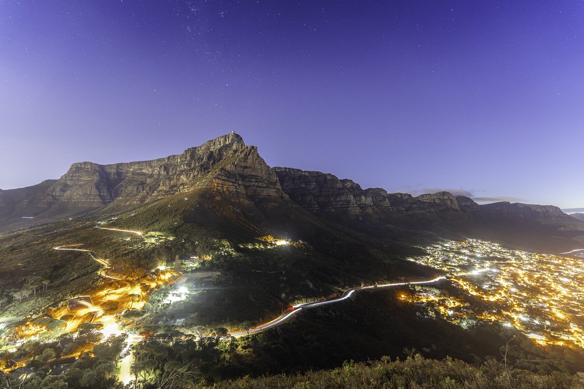As the last rays of light simmered on the horizon, a full moon rose above the bustling city of Cape Town. The duality of light sources painted the face of Table Mountain, as the night sky slowly prevailed. #photograghy #africa