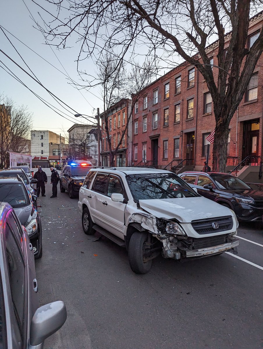 SafeStreetsJC's tweet photo. #JCcrashes Erie near 1st St. A driver of an SUV barreled into two parked vehicles. The SUV was missing a front license plate. Thankfully no injuries. https://t.co/xo4azyDlxZ