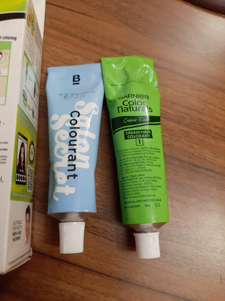 Found a fake @garnierUSA product being sold on @AmazonIN . It was shrink-wrapped, but inside it contained TWO colorants - and one from a different brand! We thought it was new packaging for the 'Developer milk'. We've never bought or used this other brand (the one in light blue).