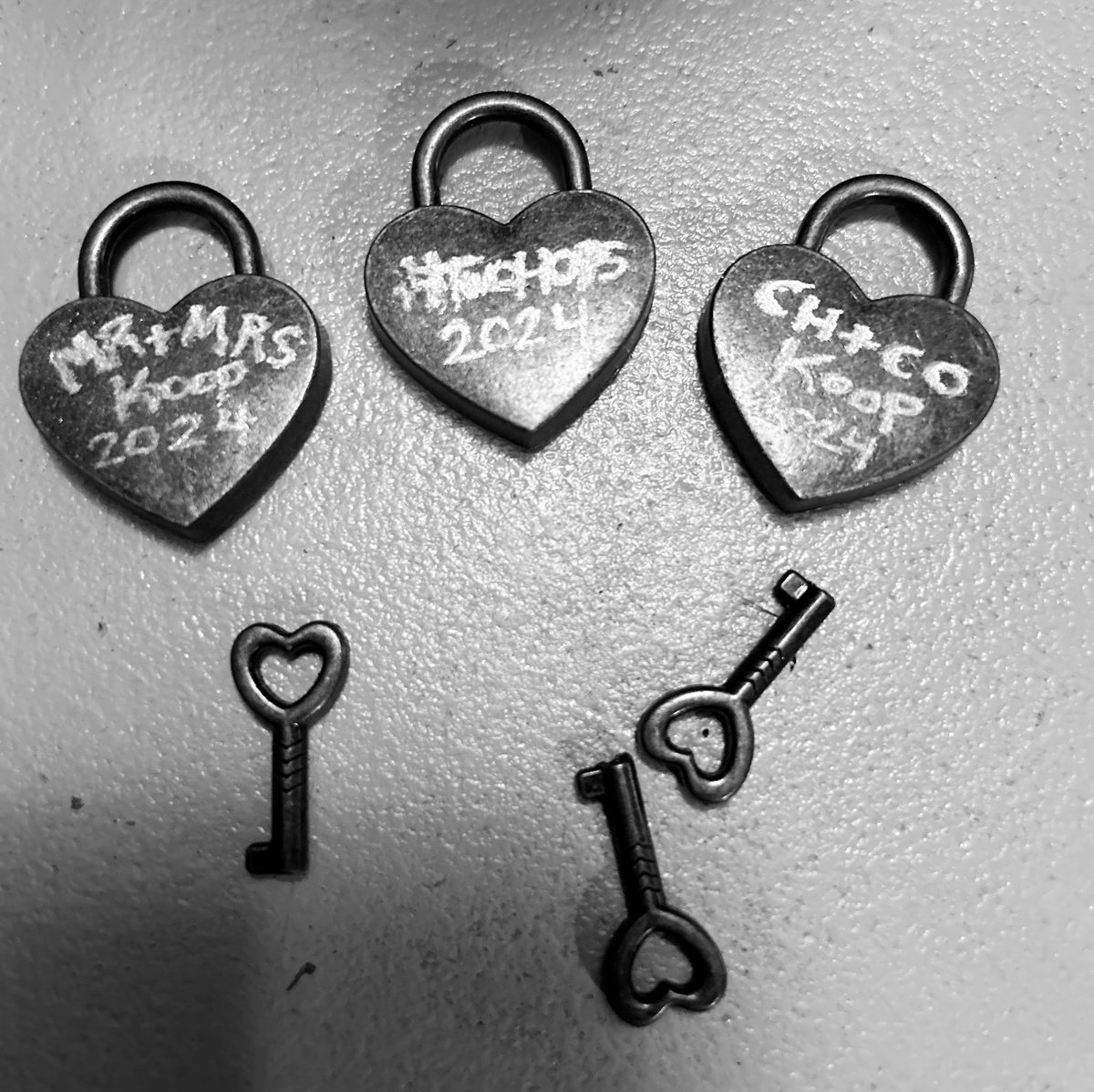 christellar's tweet photo. I “engraved” these for our honeymoon! After we lock them on a bridge we throw the key in the water to symbolize our eternal love 🔑 #twoHops #europe2024 https://t.co/tSodocRrL8