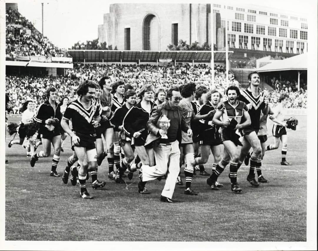 JNBuffier's tweet photo. @fanfoxleague @AjLucantonio @AndrewVossy @LaraPitt_ @FOXNRL Any footage of Roy Masters on the field with his players before and after games.
He seemed to love it, and his players loved him. Can’t imagine a modern day coach showing these emotions. #ASKFANFOX https://t.co/JYyEFK2mPL
