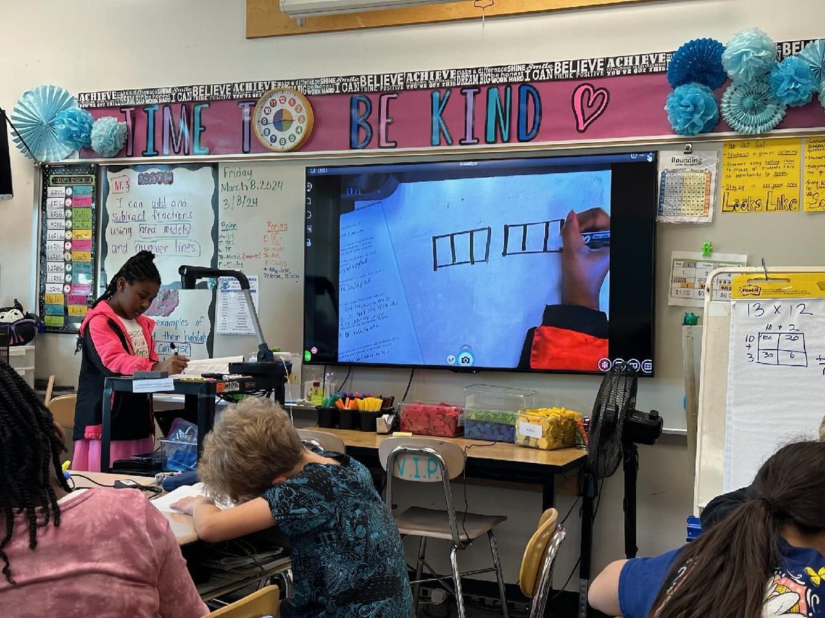 Showing off 4th grade math skills!  The student has become the teacher.  #dualschool
