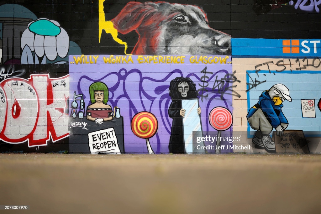 A general view of a Willy #Wonka inspired mural in #Glasgow, #Scotland. Artist #Ejek memorialized the recent failed event in the city, which went viral for promising an "immersive experience" but fell short of its advertising. I March 12, 2024 I 📷:  Jeff J Mitchell #GettyNews