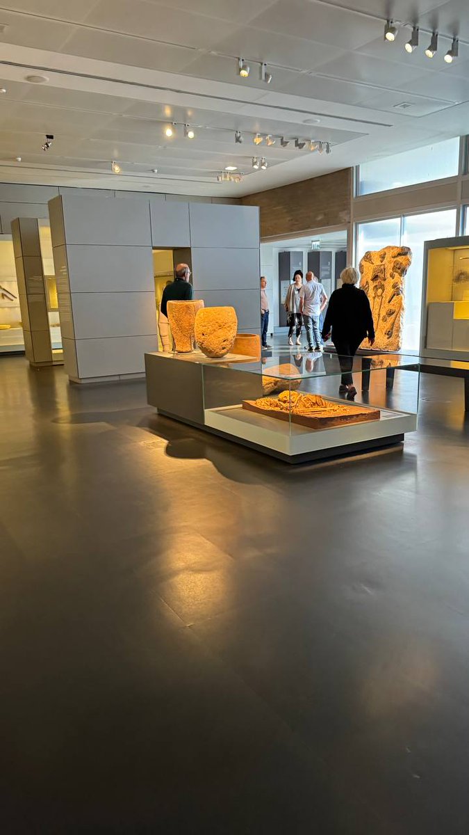 QudsNen's tweet photo. During their visit to the Israel Museum, Eli Escosido, the Director of the Israel Antiquities Authority, accompanied by David Barry, the chairman of the Elad Association, and their team, observed antiquities looted from Dier Al Balah in Gaza by Israeli forces, which were displayed at the museum just days after being looted.
