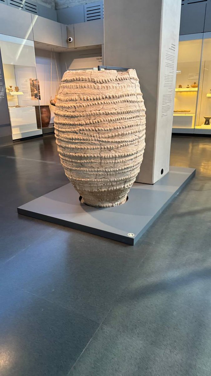 QudsNen's tweet photo. During their visit to the Israel Museum, Eli Escosido, the Director of the Israel Antiquities Authority, accompanied by David Barry, the chairman of the Elad Association, and their team, observed antiquities looted from Dier Al Balah in Gaza by Israeli forces, which were displayed at the museum just days after being looted.