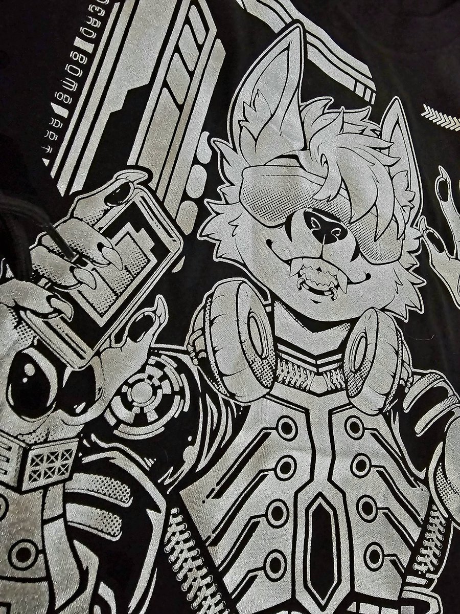 I also have this really nifty Metallic Sliver print of Cyberpunk Foxtek. Should I give it away on Twitter? Put it in the art show or charity at TFF? Carry it in the sh0p as a second color option?