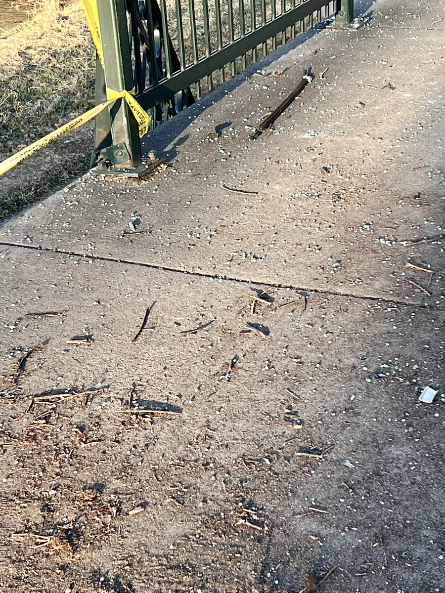 Ottelia's tweet photo. Lots of glass on the access ramp to Cherry Creek Bike Path today at Downing and Speer left over from the single car accident last night. Driver unhurt. Two guardrails and one light post were completely demolished. #BikeDen @DenverDOTI @MikeJohnstonCO https://t.co/LKdHELND1V