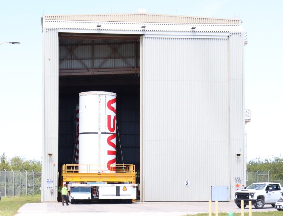 Our @NASA_SLS left center-center segment, recently painted with the @NASA 'worm' logo, has now joined the painted right center-center segment and other processed segments for safe keeping at the 'Surge 2' storage building at the Rotation, Processing and Surge Facility at