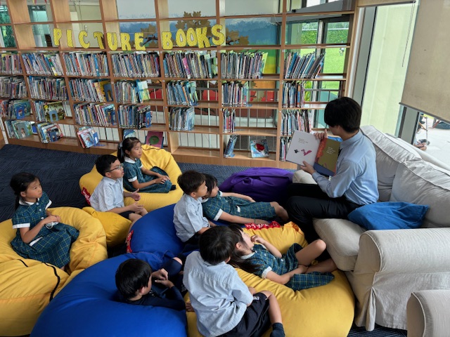 MCMPrePrep's tweet photo. In the Tuesday Tales Corner yesterday, was Bryan Chan.  He read a variety of books including Lazy Ozzie, Owl Babies and A Bit Lost.  Thank you Bryan for coming down to read to our Year 2 and 3's. https://t.co/cJ14lVfDn9