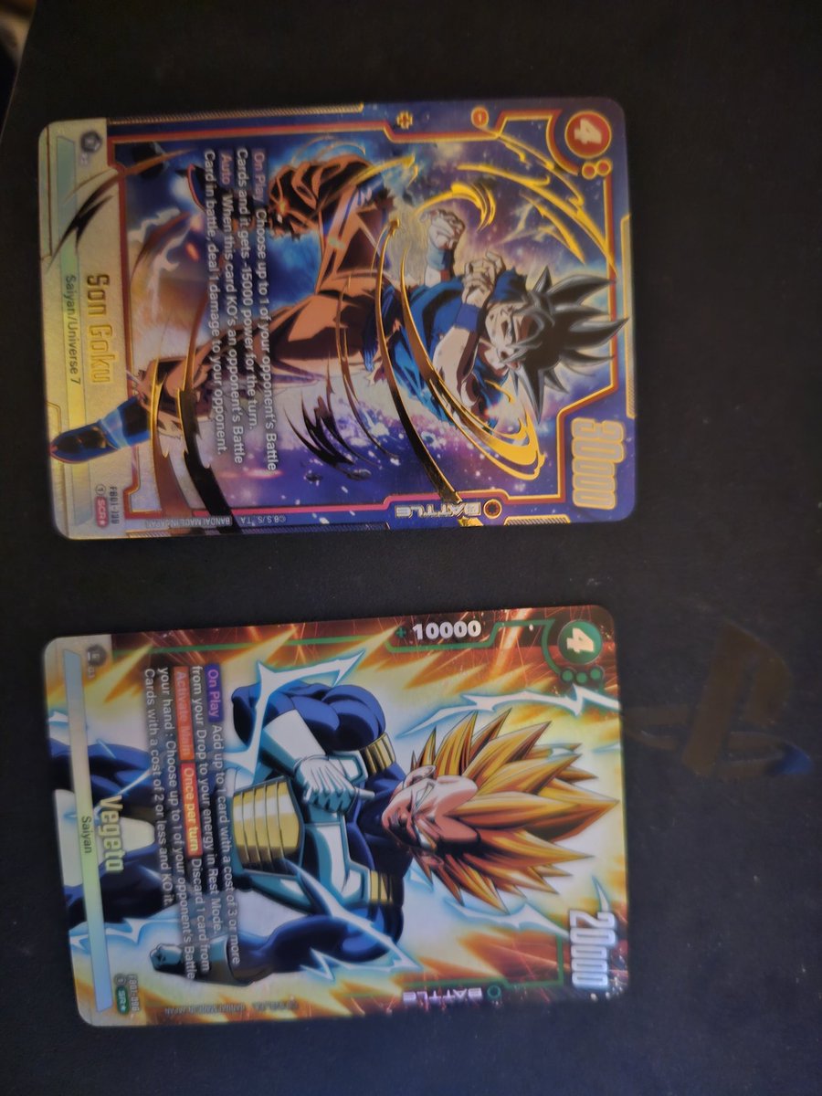 PowerGamer12245's tweet image. Horrible picture but I opened 2 singles and got the alt art of SCR UI Son Goku and the Alt Art of SR Super Vegeta!! 
@Rhymestyle