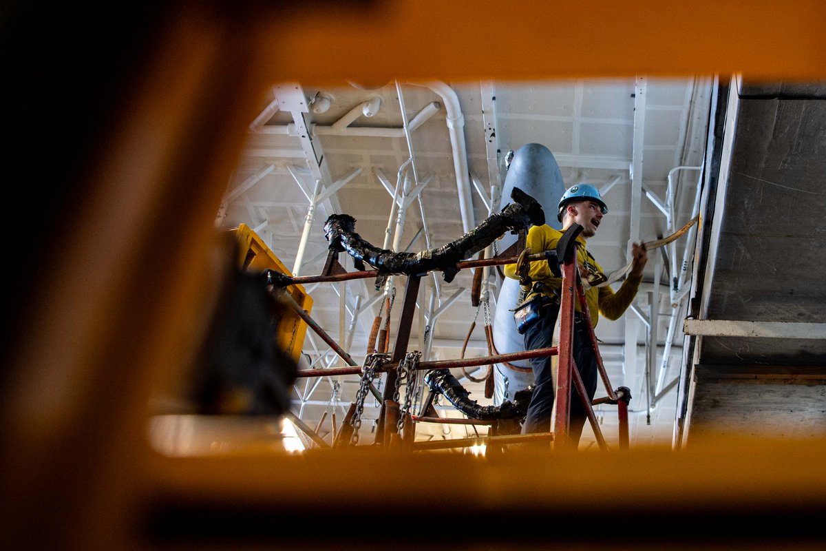 U.S. Navy Sailors transport and secure helicopter blade storage containers in the hangar bay aboard the Nimitz-class aircraft carrier USS Theodore Roosevelt (CVN 71). #USNavy | #ForgedByTheSea