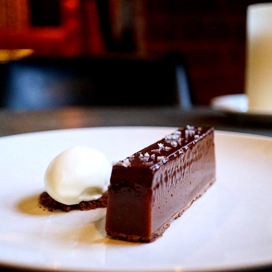 Tosier 72% chocolate tart, salted caramel, sheep's milk ice cream. Trust us, you don't need to be a chocoholic to fall for this Unruly sinful dessert on our à la carte.😋🐷 Menu details: vmne.ws/3T8PerP #chocoholic #dessertlover #theunrulypig #gastropub #foodie
