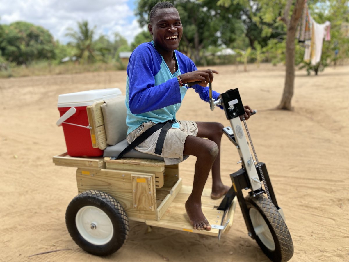 PartnersforCare's tweet photo. Junken Assa Zoneka nicknamed Madonge by his customers for being hardworking supports himself by selling various items at the Kwaupanga Trading Center.  The PFC Kilifi Program team recently replaced his old cart with a new one. This improved his mobility and overall lifestyle. https://t.co/yPxHsrU16x