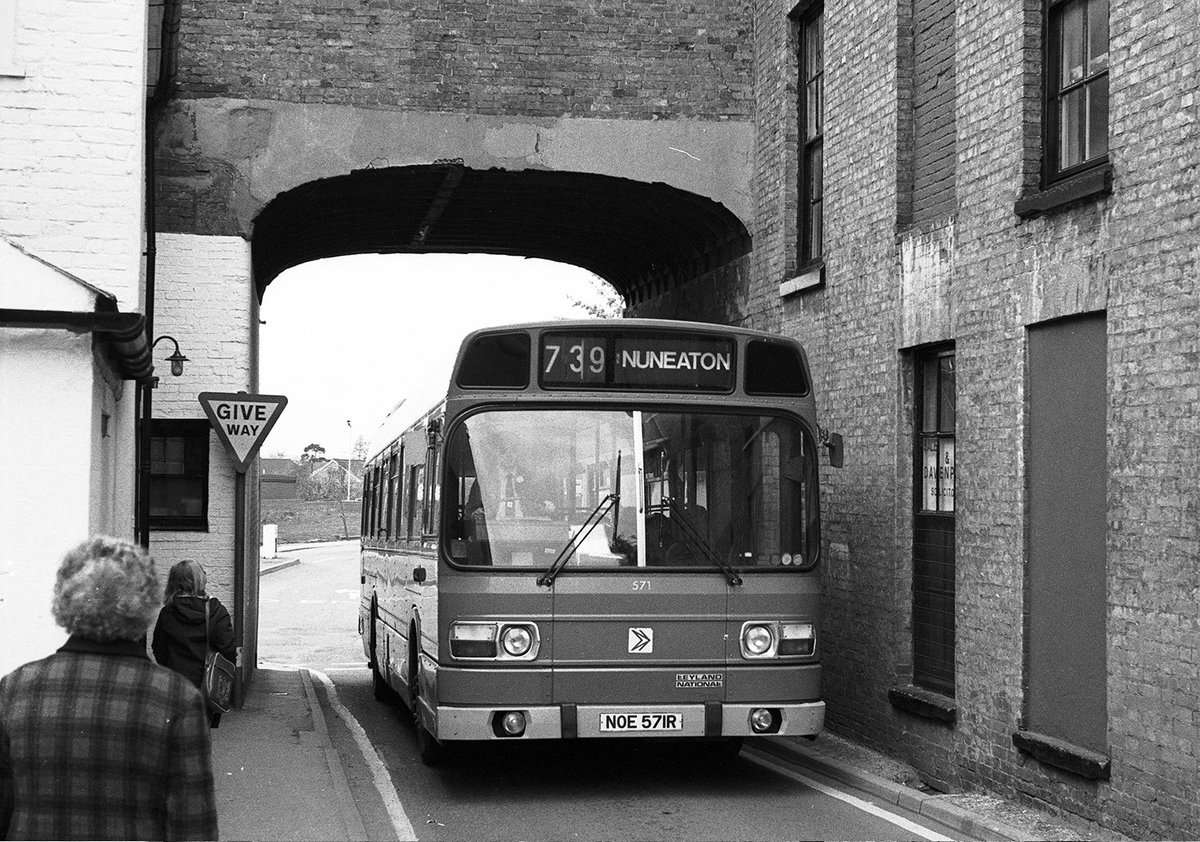 The Midland Red 739 service in Nuneaton historically operated between Nuneaton and Arley but in May 1979 was extended to Atherstone via Ridge Lane and Birchley Heath. Pictured are BMMO S23 5978 (UHA 978H) leaving Birchley Heath & in  Atherstone is Leyland National 571 (NOE 571R)