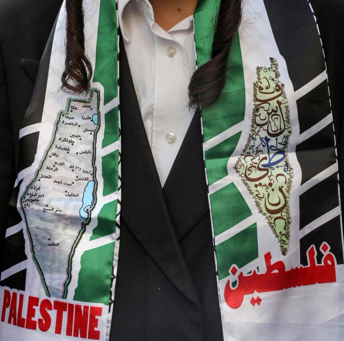 The scarf around the neck of a young Torah Jew who considers himself a Palestinian Jew. Israel is not the state of the Jews. Zionism is not Judaism. Jews are not Zionists. Zionists are not Jews.