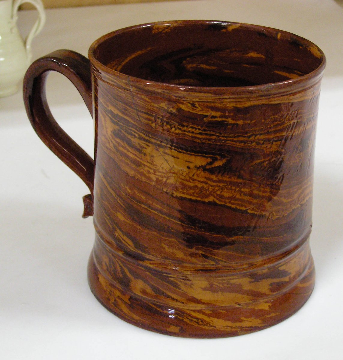 Most historic ceramics that I've copied have a surface design. 18th C. British agateware is different, made of two clays wedged together. During trimming the marbling is revealed. I love how this one turned out! Sherds were recovered in St. Augustine, Florida.

#maniarchaeology