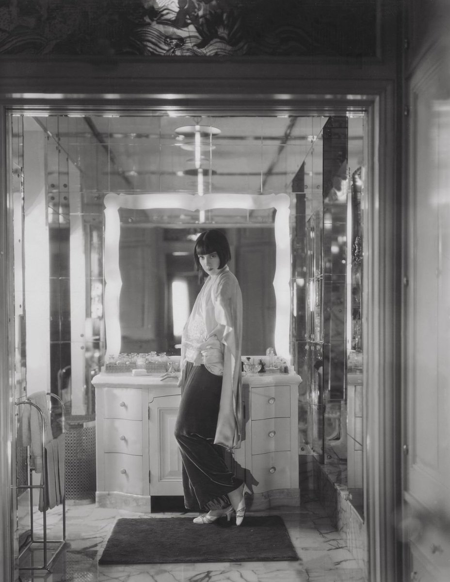 Colleen Moore in her yellow onyx and mirrored bathroom in her Bel Air home, 1929.