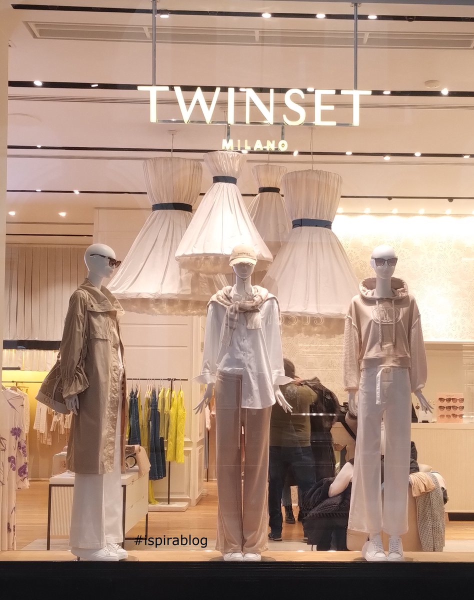 thinkretail's tweet image. Twin Set Turin - Spring 2024 Womenswear Collection - white garments with beige trench, trousers and hoodie, beige handbag and white sneakers #twinset #ispirablog  urly.it/3-p_h