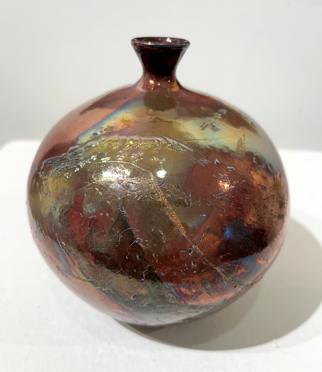 Copper Moon, raku fired bottle neck vessel, wheel thrown with stoneware clay. Artist: Dolores Thomson, Glens Falls, NY.  Artwork of the Week ( #ncprartwork ) is supported by Downtown Artist Cellar: downtownartistcellar.com