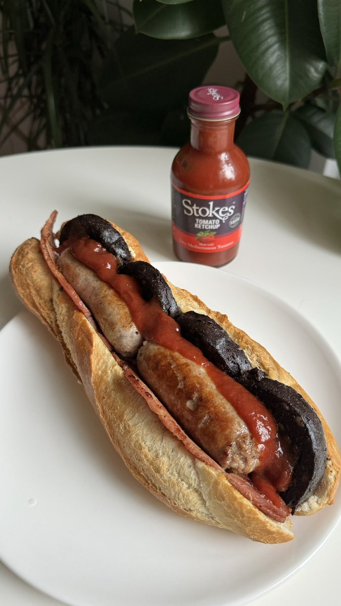Sausage, black pudding and bacon baguette topped with Tomato Ketchup by Stokes Sauces.  It’s not often I cook breakfast at home but this tasted incredible! Which sauce do you add to your breakfast baguette? Meats by Paul’s Butchets on Norwich Market. #food #stokessauces