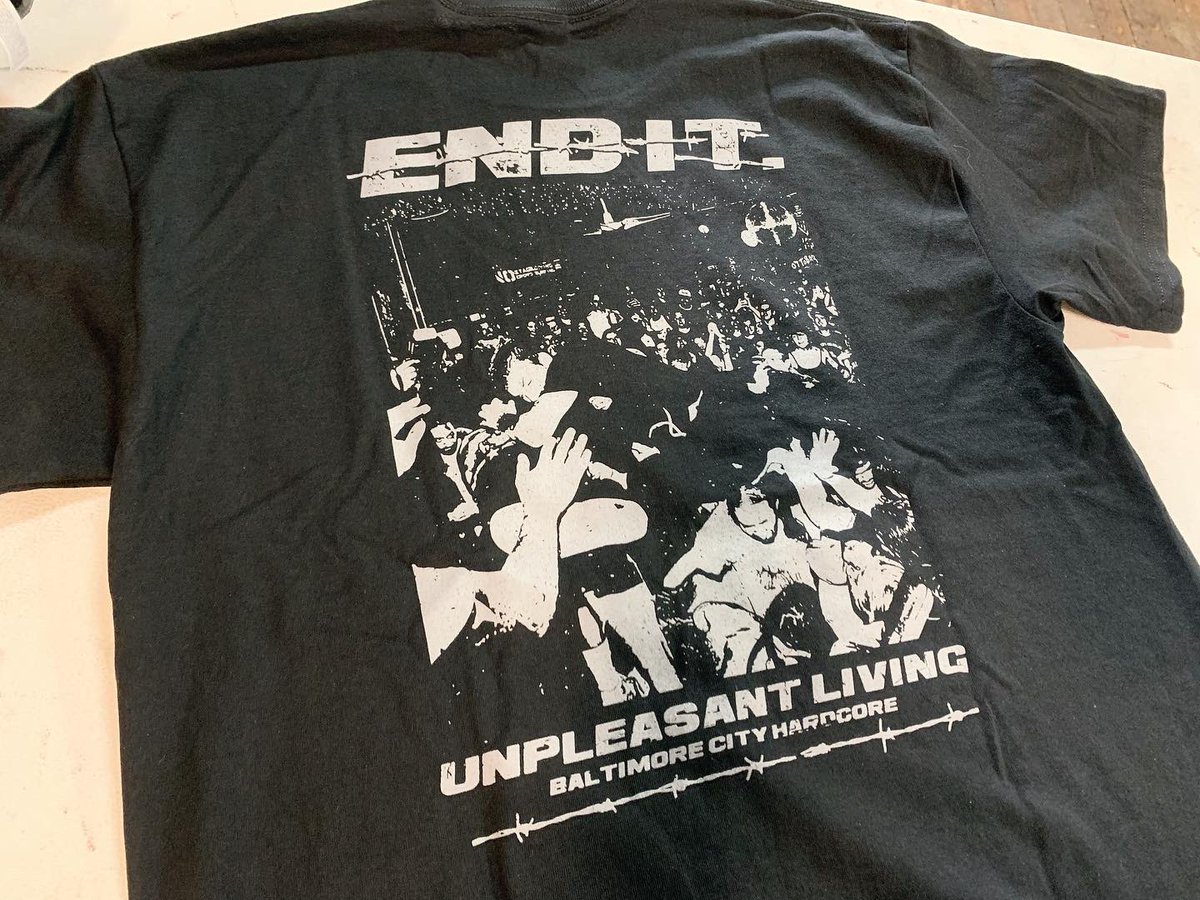 End It “Unpleasant Living” T-Shirt. Available in S-3XL. Printed on Gildan or comparable. Purchase - brasscitymerch.com
