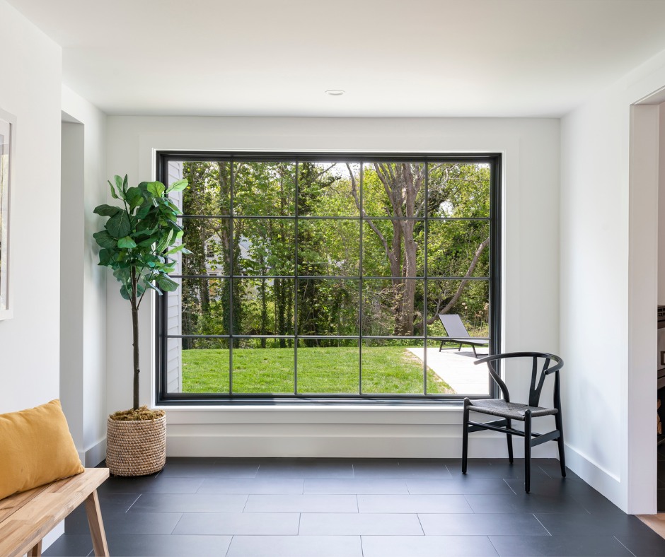 A hallway with an oversized window between the front, historic portion of this home and the new rear addition creates a much-needed primary entrance and a thoughtful transition between the two spaces.
#BuiltByPhilbrook in collaboration with A3 Architects #Route6A #CapeCodBuilder