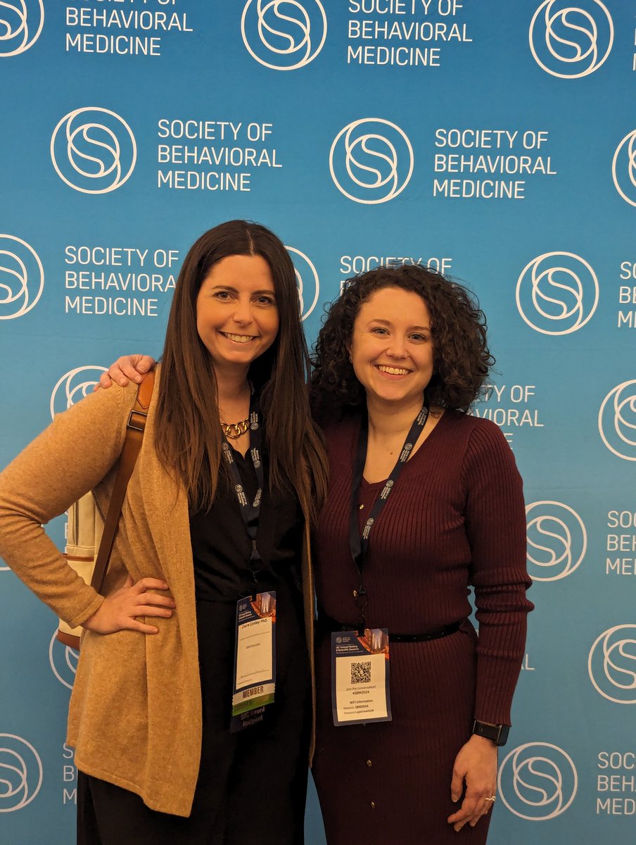 Obligatory #SBM2024 photo wall pic! @AlainaCarr19 and I are here repping @GeorgetownCPC @LombardiCancer! (📸 credit goes to the @BehavioralMed volunteer stationed there to prevent awkward millennial selfies, thanks for the assist!) #ECRchat #NewPI