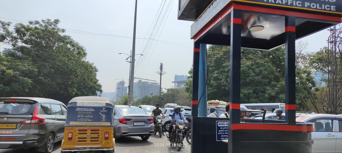 This is the chaotic scene at the signal before Q city in Financial district Hyderabad.
Why can't Traffic police post a constables in the mornings/evenings to regulate Traffic jams from Wipro circle to Gowlidodi in Financial district Hyderabad daily?