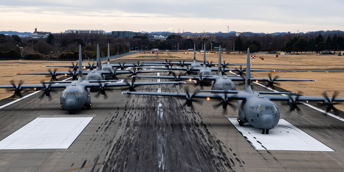 Seven USAF C-130J Super Hercules aircraft assigned to the 36th AS taxi onto the runway before takeoff for exercise Airborne 24.