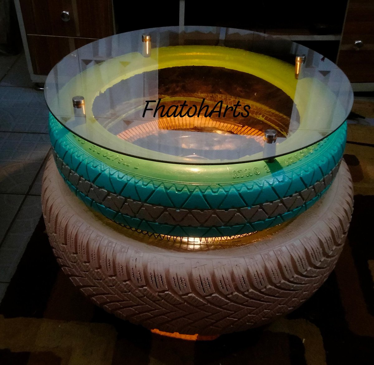 fhatoh_s's tweet photo. I recycled old tires  and made center table and added a bit of light.. https://t.co/c7SiNo1fF1