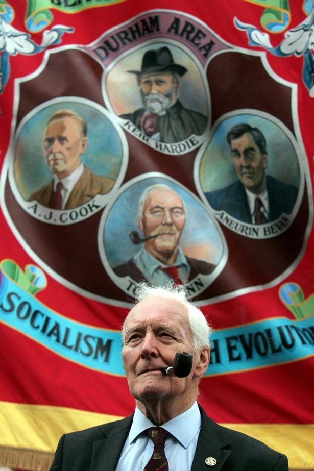 Remembering the great Tony Benn, who passed away ten years ago today, on 14 March 2014. He's pictured with the Blackhall banner, which carries his portrait. As is tradition when we lose one of our own, the Blackhall banner was draped in black at the Gala that year.