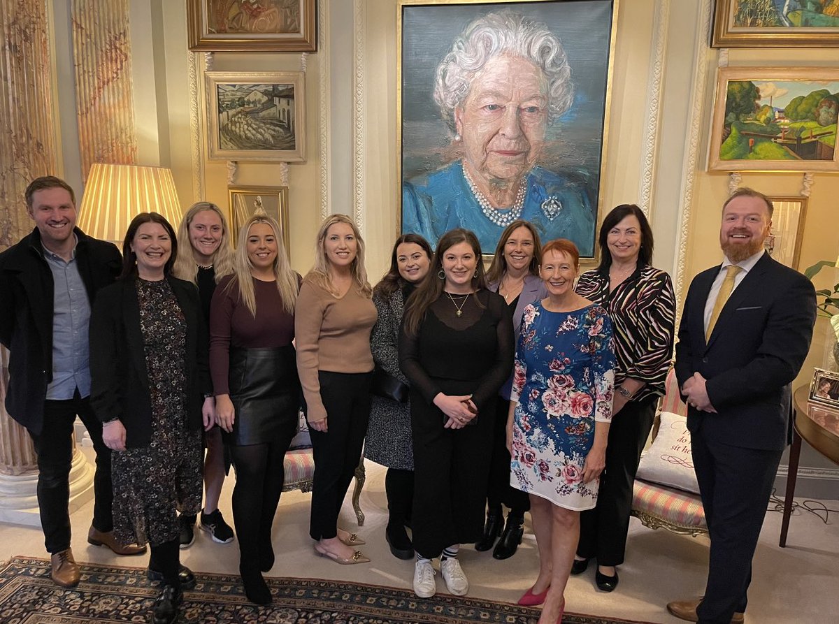 Our staff are visiting historic Hillsborough Castle today so we took the opportunity to get photographed with the portrait of our former patron the late Queen, commissioned by @cooperationirl and painted by @colin_davidson 🖼️