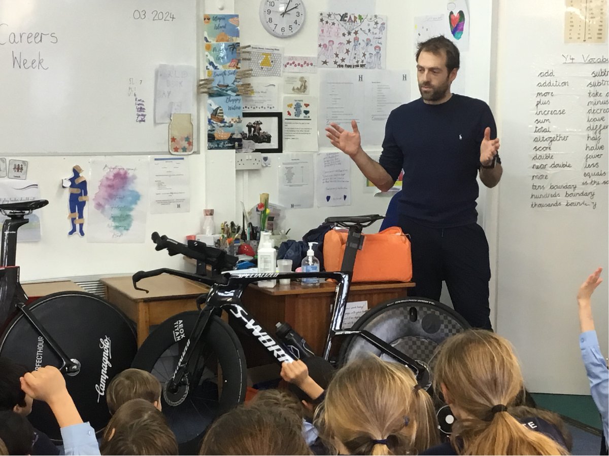 A massive thank you to cycling superstar @alexdowsett for talking to the children about a career in pro sports for Heathcote #CareersWeek. Brought in some very expensive-looking bikes too! #ReachTheSky