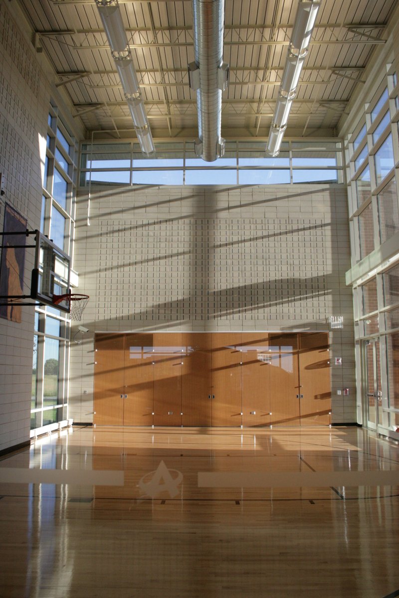 GYHarch's tweet photo. As #MarchMadness is upon us, today's #ThrowbackThursday is one of our favorite #basketball courts! We designed this #1/2Court to double as the Community Room at #AlliedFirstBank in #Oswego 

#TBT #NCAA #CollegeBasketball https://t.co/4PM2PQO4DV