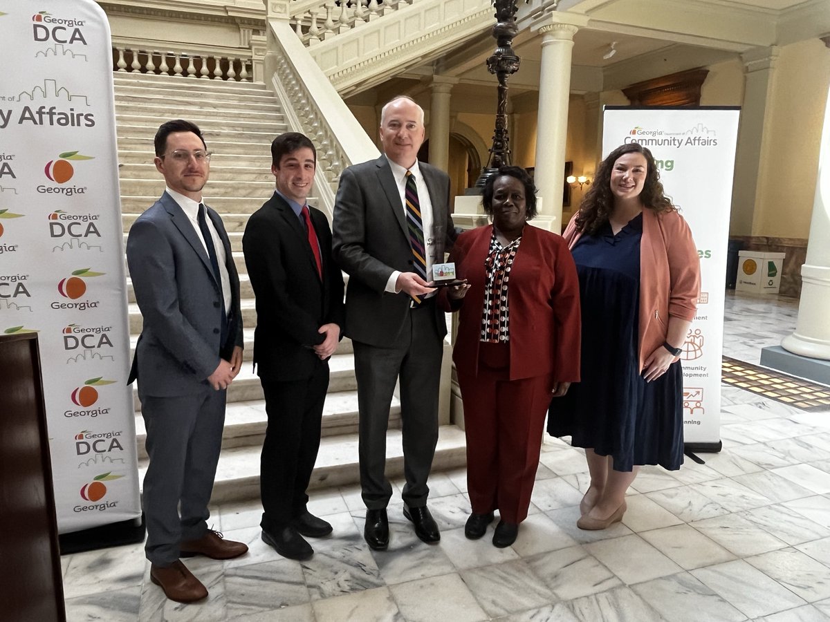 GA_DCA's tweet photo. Today at the Capitol, Commissioner Christopher Nunn congratulates Bainbridge, Hawkinsville, @cityofmarietta, and Perry on achieving the PlanFirst designation. Their dedication to comprehensive planning and community development sets a shining example for all. #PlanFirst https://t.co/Q18RJKSqGI